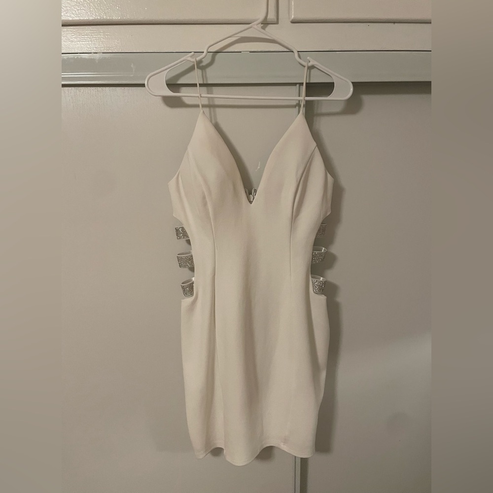 White mini dress with side rhinestone straps design
